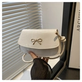 Off-white crocodile texture crossbody bag featuring a golden bow metal buckle - White
