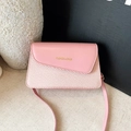 Pink minimalist crossbody bag featuring premium leather and woven texture combination - Pink