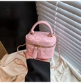 Detail of pink quilted mini box bag with golden metal chain and dual zipper hardware - Pink