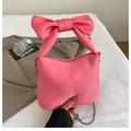 Pink fabric handbag with large bow handle and silver chain strap for summer style - Pink