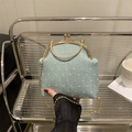 Chic mint blue tweed crossbody bag with golden chain and bead clasp on a modern shelf - Green