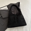 Black matte minimalist tote bag with a decorative bow and thin shoulder strap - Black