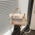 Minimalist beige leather handbag with metal chain clasp and thin shoulder strap - White