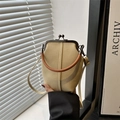 Vertical beige canvas kiss-lock crossbody bag with dark brown top handle and slim strap - Khaki