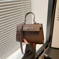 Classic dark brown leather satchel with silver lock and top handle for modern women - Brown