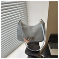 Detail of grey woven crescent bag with light blue strap and gold bow metal buckle - Blue