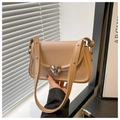 Detail of silver heart-shaped lock on light brown leather crossbody bag with stitching - Khaki