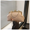 Detail of vintage pink canvas shell bag showing gold metal clasp and chain strap textures - Pink