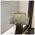 Detail of light green polka dot shell bag with vintage gold handle and clasp - Green
