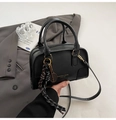 Detail of black PU leather boston bag with golden tennis racket charm and woven tassel - With Pendant / Black