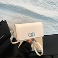 Creamy white leather crossbody bag with silver Gancini-style buckle and thin strap - White