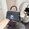Elegant black sequin crossbody handbag with gold geometric turn-lock and leather handle - Black