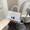 Silver-grey luxury handbag with shimmering texture and metallic turn-lock closure - Silver