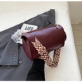 Burgundy faux leather cylindrical crossbody bag with wide geometric pattern strap - Burgundy