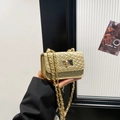Chic mini woven crossbody bag in metallic gold finish with chain strap and clasp - Gold