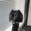 Chic black pleated drawstring bucket bag with pearl accents and silver chain strap - Vertical Pleated Texture / Black