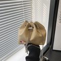 Fashionable woven bucket bag with silver chain strap and pearl drawstring detail - Dense Woven Texture / Khaki