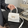 Elegant white mini square handbag with gold bow buckle and adjustable strap - White