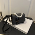 Mini crossbody bag with grey woven texture, pearl handle, and black leather strap - Black