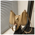 Detail of beige underarm bag with gold pyramid stud and smooth synthetic leather - Khaki