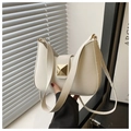 Detail of cream leather half-moon bag with golden square rivet buckle and shoulder strap - White