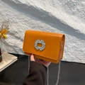 Chic orange faux leather crossbody bag with square rhinestone buckle and silver chain - Brown
