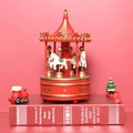 Christmas carousel music box in red and gold with four white horses on a red book - Red