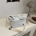 Minimalist white nylon crossbody bag with pleated texture and adjustable strap - White