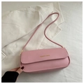 Detail of pink faux leather baguette bag with 'FASHION & BAGS' text on white fabric - Pink