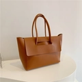 Detailed view of the large caramel tote bag featuring a minimalist flap and handle design - Brown