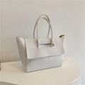 Detailed view of the white minimalist tote bag with unique handle and flap design - White