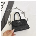 Detail of black glitter mini handbag with silver butterfly buckle and chain strap - Black