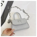 Detail of silver glitter mini handbag featuring a metallic bow and chain strap - Silver