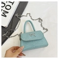 Detail of mint green glitter handbag with silver butterfly buckle and chain strap - Sky Blue