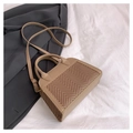 Detailed view of beige herringbone weave texture and leather strap on a stylish crossbody bag - Dark Khaki