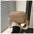 Close-up of khaki square crossbody bag with wide woven strap and golden hardware details - Khaki