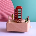 Retro wooden music box with red British telephone booth and moving car on top - British Red Telephone Booth Style / Brown