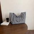 Classic black and white striped canvas tote bag with dual handles and front pocket - Black