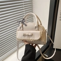 Creamy white semi-circular handbag with lace edges and a classic gingham bow accent - White