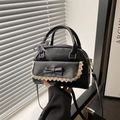 Black vintage Boston handbag with lace trim and bow accent in a versatile crossbody style - Black