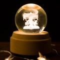 Glow crystal ball with carousel laser engraving on a warm LED beech wood base - Carousel / Track: Encounter