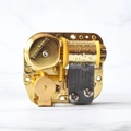 Mechanical wind-up music box movement in gold finish with precise internal metal gears - Romantic Melody Moon Style (173)