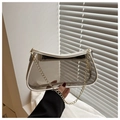 Close-up of transparent PVC shoulder bag with white leather trim and gold chain strap - White
