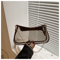 Detail of transparent PVC underarm bag with brown leather trim and golden metal chain - Brown