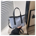 Minimalist light blue-grey small tote bag with black webbing handles and shoulder strap - Blue