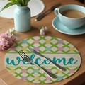 Round linen placemat with welcome text and colorful floral grid pattern on wooden table - Floral Welcome Text (CDE1--12)