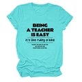 Detail of rolled cuffs and black text print on a teal casual cotton teacher T-shirt - Deep Water Blue (Black Font)