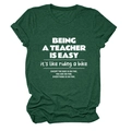 Detail of dark green cotton T-shirt featuring white Being a Teacher Is printed text - Vintage Green (White Font)