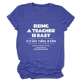 Close-up of blue heather cotton T-shirt featuring white teacher slogan typography - Vintage Blue (White Font)