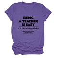 Detail of dark purple crew neck teacher t-shirt showing fabric texture and typography - Purple (Black Font)